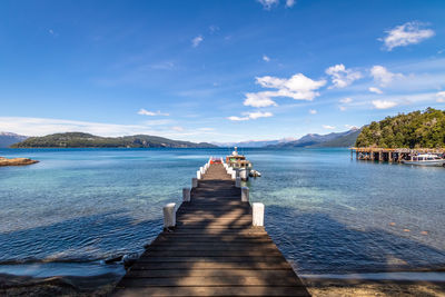 Pier over lake against sky