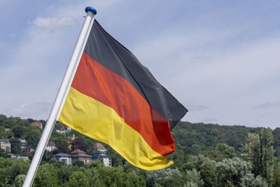 Low angle view of flag against sky