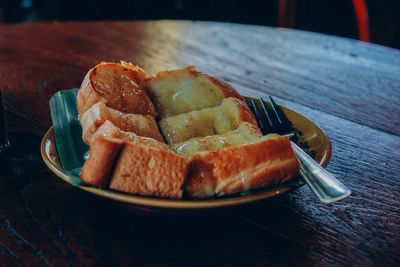 Close-up of bread in plate on table