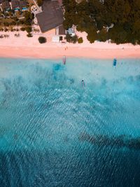 People swimming pool in sea