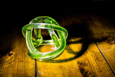 Close-up of green leaf on table