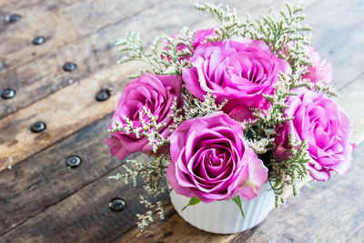 High angle view of pink roses on table