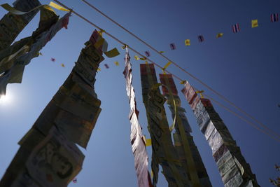 The banknotes are arranged together and hung down for beauty.
