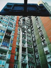 Low angle view of basketball hoop and building