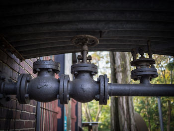 Close-up of pipes and valves at nature park schöneberger südgelände, berlin