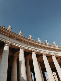 Low angle view of statue against blue sky