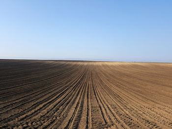 Scenic view of desert against clear sky