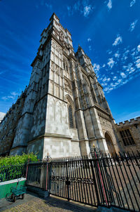 Low angle view of historical building against blue sky