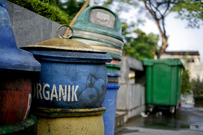 Close-up of stack of garbage bin in row
