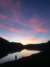 Scenic view of lake at sunset