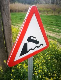 Close-up of road sign against trees