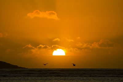 Scenic view of sea at sunset