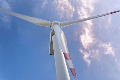 Low angle view of wind turbine against sky