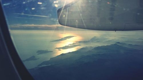 Aerial view of landscape seen through airplane window