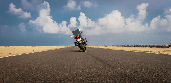 Man riding motorcycle on road