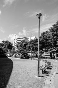 Street lights in park against sky