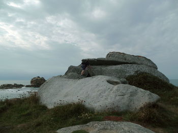 Rock formations by sea against sky,bretagne, france