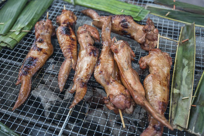 High angle view of meat on barbecue grill