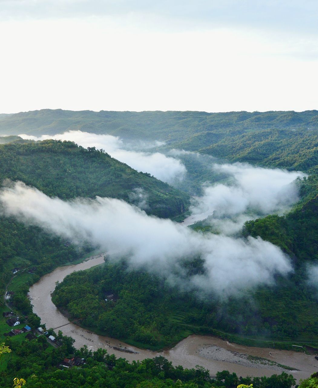 scenics, water, beauty in nature, high angle view, nature, tranquil scene, sky, landscape, tranquility, grass, cloud - sky, sea, idyllic, day, fog, mountain, outdoors, motion, surf, non-urban scene