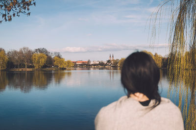 Rear view of woman against sky