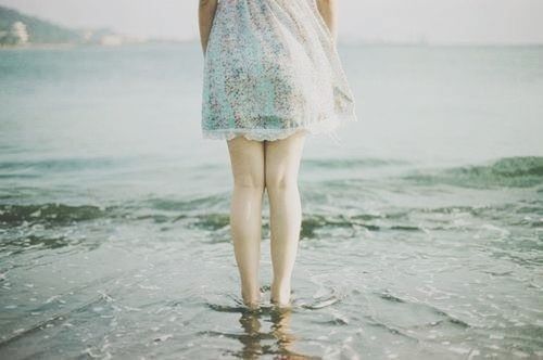 water, sea, lifestyles, beach, person, low section, leisure activity, standing, rear view, shore, wave, barefoot, vacations, horizon over water, focus on foreground, nature, sand