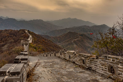 Steps leading towards mountain range against sky