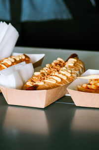 Freshly prepared hotdogs in a paper box. food delivery concept.