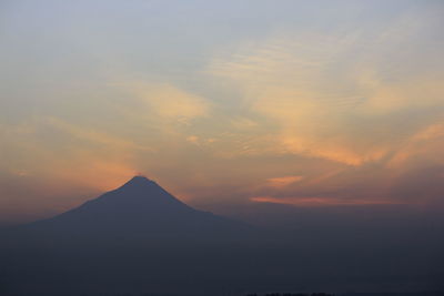 Scenic view of silhouette mountain against sky during sunset