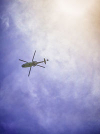 Low angle view of airplane flying in sky