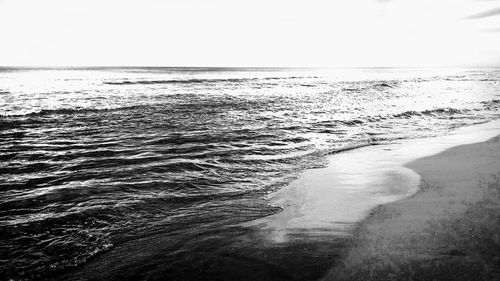 Scenic view of beach against clear sky