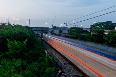 High angle view of light trails on railroad tracks against sky