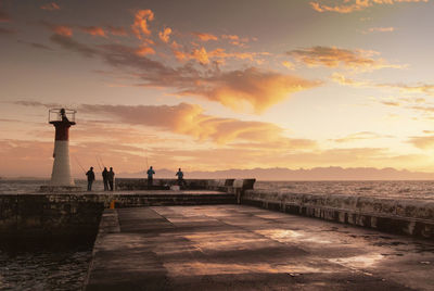 Scenic view of lighthouse against sky during sunset