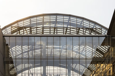 Low angle view of modern building against clear sky