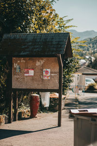 Table by house against trees and plants
