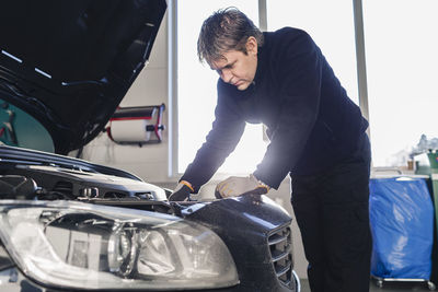 Mechanic repairing car in auto repair shop