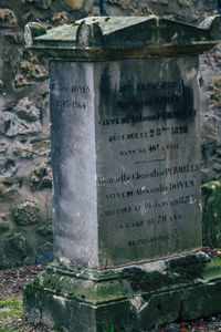 Close-up of text on stone at cemetery