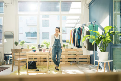 Fashion designer standing in her studio