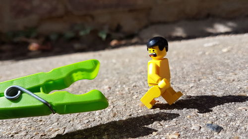 Close-up of yellow toy on leaf