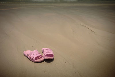 High angle view of shoes on sand