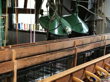 Close-up of clothes hanging on shelf in restaurant