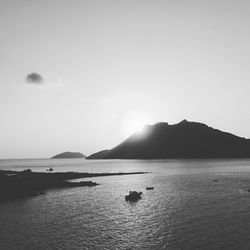 Scenic view of mountain in sea at amorgos against sky