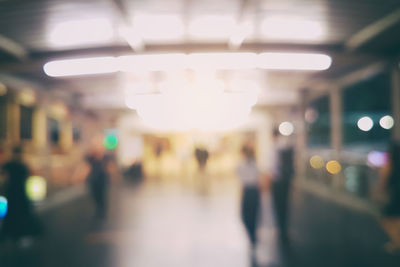 Defocused image of illuminated train at railroad station