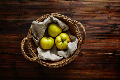 High angle view of apples in basket on table