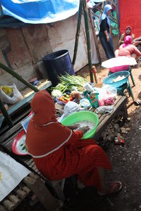 High angle view of people sitting at market