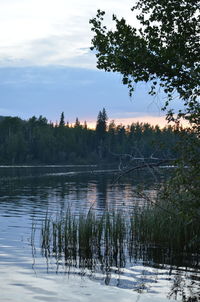 Scenic view of lake against sky during sunset