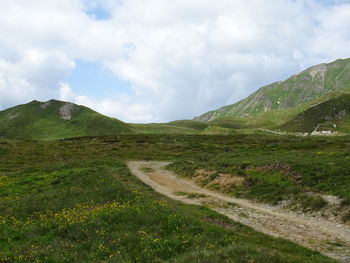 Scenic view of landscape and mountains against sky