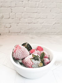 High angle view of strawberries in plate on table