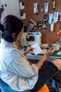 High angle view of woman using laptop at home