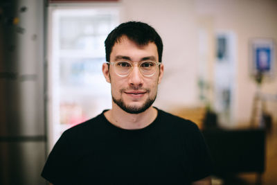 Portrait of man standing outdoors