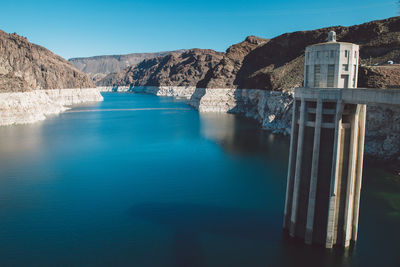 Scenic view of river against blue sky